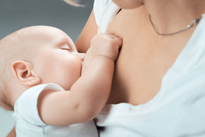 A photo of a baby breastfeeding