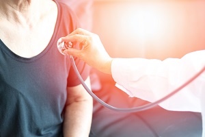 Picture of a Physician holding a stethoscope up to check elderly woman's heartbeat
AMERICA HEART HEALTH MONTH